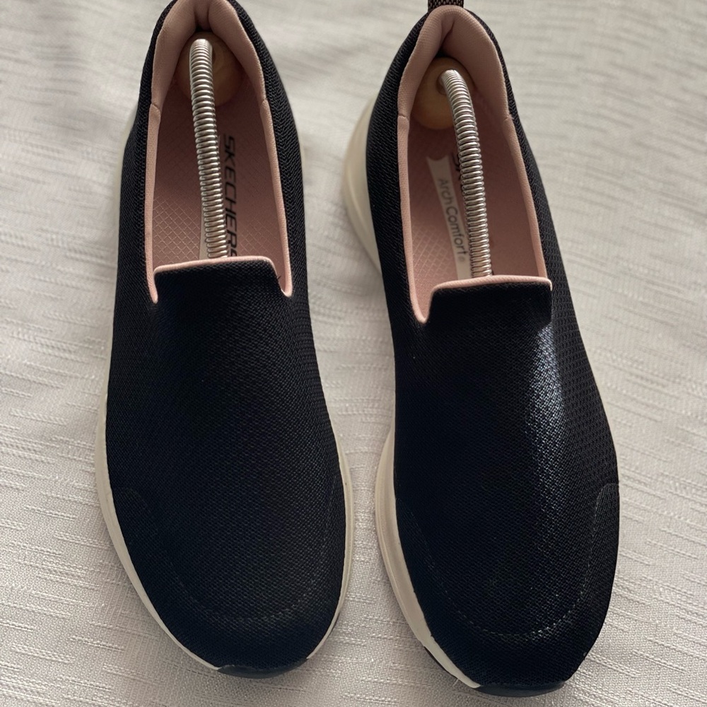 Skechers Women's Black Slip-On Sneakers with Pink Lining